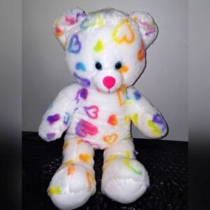 A Build- A-Bear plush rainbow hearts bear. Pre-loved in great condition.